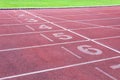 Numbers starting point on red running track,running track and green grass,Direct athletics Running track at Sport Stadium Royalty Free Stock Photo