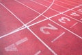 Numbers starting point on red running track,running track and green grass Royalty Free Stock Photo