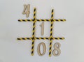 The numbers zero, one, four, eight lie in the game of tic-tac-toe, in a grid on a white background. The grid consists of colored