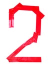 Numeral 2 symbol made of red tape pieces, isolated on the white