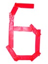 Numeral 6 symbol made of red tape pieces, isolated on the white