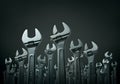 Numerous adjustable wrenches are standing upright on a dark background. Royalty Free Stock Photo