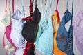 Numerous Colorful Bras Are Hung On A Close Line In A Studio Environment