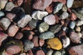 Numerous colorful stones that make up the beach.