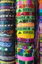 Numerous colorful wristbands with Oaxaca sight for sale at craft