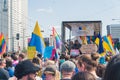 Numerous crowd of proud European LGBTQAI members and allies during an annual Equality Parade. Colourful gay flags