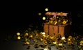 Numerous gold coins spilled out from the treasure chest. Old-style wooden treasure chest tightly assembled with rusted metal