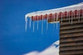 Numerous icicles on the edge of a cabin roof at Balea Lake, Romania Royalty Free Stock Photo