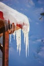 Numerous icicles on the edge of a cabin roof at Balea Lake, Romania Royalty Free Stock Photo