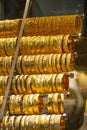 Numerous rows of gold bracelets in the jewelery showcase