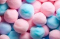 numerous soft, fluffy cotton candy balls in pastel shades of pink and blue background. sweets, softness, comfort