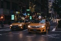 Numerous yellow taxis on the street in New York at night. Royalty Free Stock Photo