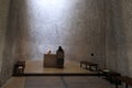 A nun at an alter inside the Notre Dame du Haut chapel in Ronchamp, France Royalty Free Stock Photo