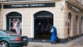 A nun stands outside a the luxury Porsche Design store in Munich Germany