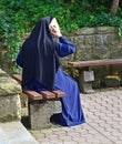 Nun with a modern smartphone