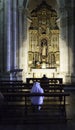 Nun praying church