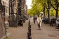 A nun riding a bike with cleric outfit