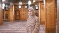 Nun in Robe Stands Inside an Islamic Mosque. Egypt