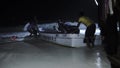 Nungwi, Zanzibar - Jan 2020: tropical night storm on Zanzibar. Group of Black African People Saving the Motor Boat From