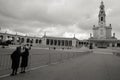 Nuns couple on fatima sanctuary square in portugal, creed mood