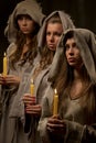 Nuns praing with candles