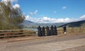 Nuns sisters in black greek orthodox religion in sunny day looking at a lake