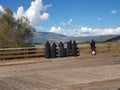 Nuns sisters in black greek orthodox religion in sunny day looking at a lake