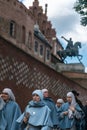 Krakow, Poland - September 23, 2018: Nuns walking in the access to the Royal Castle of Wawel in Poland, Krakow, with the