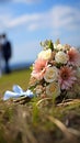 Nuptial scene Wedding bouquet rests on grass with married couple