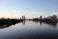 NUR-SULTAN, ASTANA, KAZAKHSTAN - JUNE 3, 2015: A beautifula panorama of Ishim river with smooth surface of water and evening city