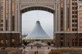 Khan Shatyr Entertainment Center seen through an arch in monumental Gate, Nur Sultan, Kazakhstan.
