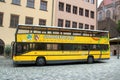 Nuremberg, Germany - August 27, 2023: Hop-On Hop-Off sightseeing bus in the city center. Tours on yellow double deckers are