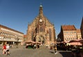Nuremberg, Germany - September 4, 2019: People near the Our Lady`s church Frauenkirche at the NÃÂ¼rnberg Hauptmarkt central Royalty Free Stock Photo