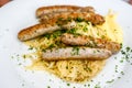 Nuremberg sausages with mashed potatoes and sauerkraut Royalty Free Stock Photo