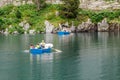 Families of tourists boating in a mountain lake Royalty Free Stock Photo