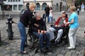 NURNBERG, GERMANY - JULY 13 2014: Tourists in wheelchairs on Hauptmarkt, the central square of Nuremberg, Bavaria, Germany.