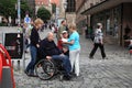 NURNBERG, GERMANY - JULY 13 2014: Tourists in wheelchairs on Hauptmarkt, the central square of Nuremberg, Bavaria, Germany.