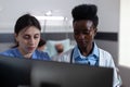 Nurse and african american doctor using personal computer for clinical imagistic Royalty Free Stock Photo