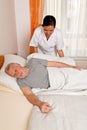 Nurse in aged care for the elderly in nursing Royalty Free Stock Photo