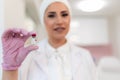 Nurse with ampoule of medicine in her hand