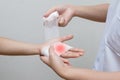 Nurse applying bandage to patient