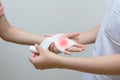 Nurse applying bandage to patient