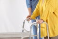 Nurse assisting senior woman with walker in hospital, closeup Royalty Free Stock Photo