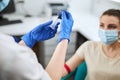 Nurse attaching the needle to the tube holder prior to blood drawing