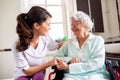 Nurse attending senior woman in a long term care facility, concept of trust Royalty Free Stock Photo