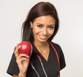 Nurse care giver holding apple Royalty Free Stock Photo