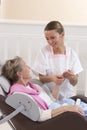 Nurse or caregiver assists an elderly woman with skincare Royalty Free Stock Photo