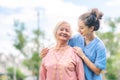 Nurse caregiver take care of Asian elderly woman in the park Royalty Free Stock Photo