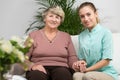 Nurse caring about elder woman Royalty Free Stock Photo