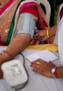 Nurse check BP or blood pressure of a Indian woman patient